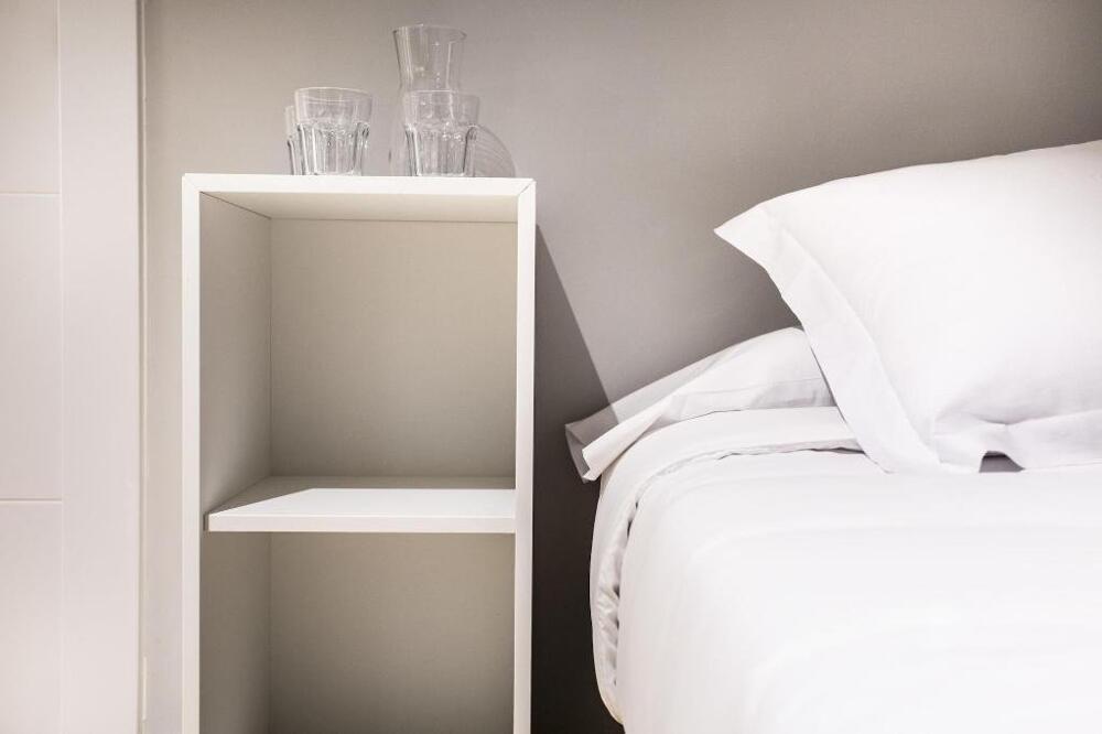 Foto de una habitación de Albergue Hola Rooms