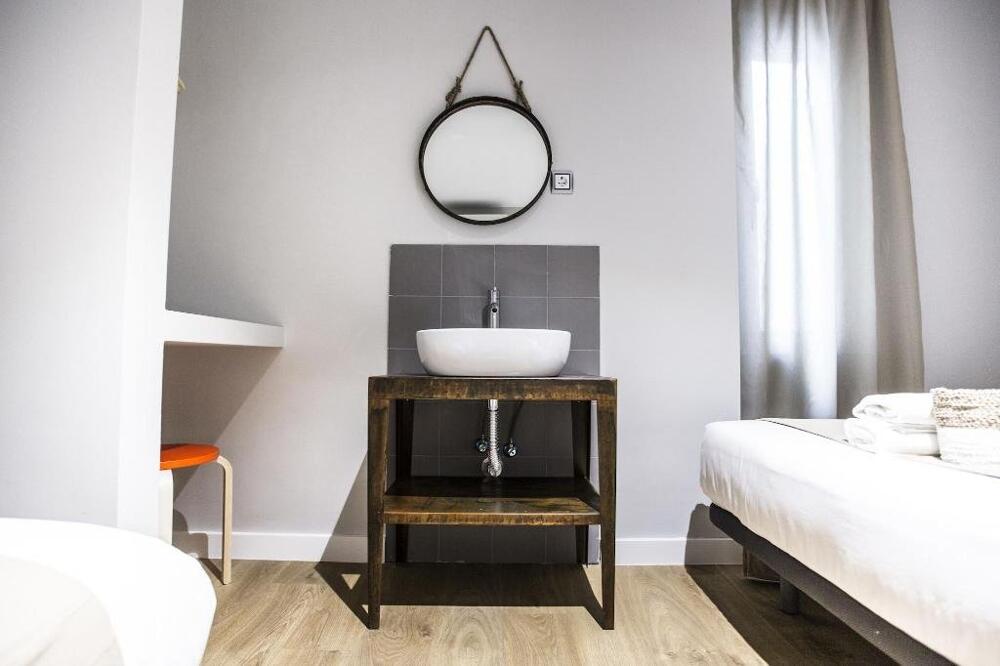 Foto de una habitación de Albergue Hola Rooms