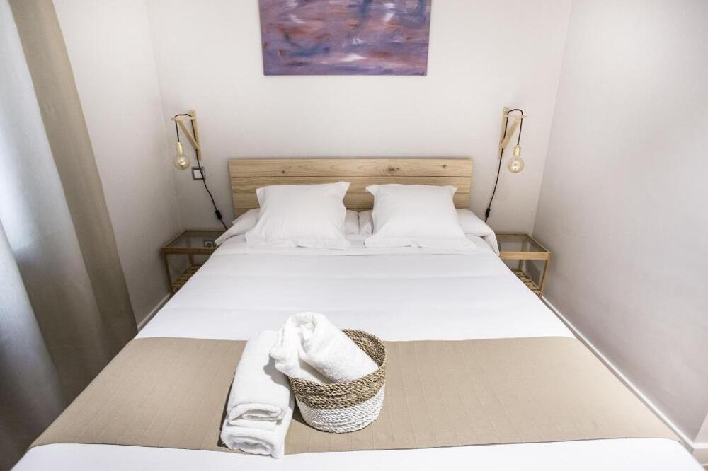 Foto de una habitación de Albergue Hola Rooms