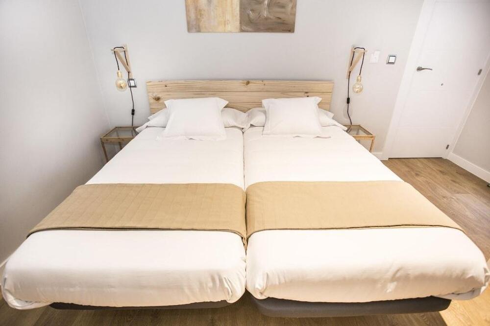 Foto de una habitación de Albergue Hola Rooms