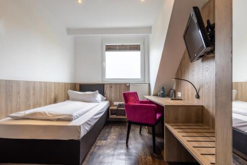 Foto de una habitación de Trip Inn Hotel Esplanade