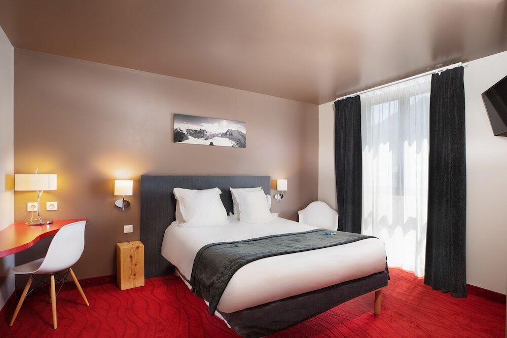 Foto de una habitación de SOWELL HOTELS Le Parc &amp;amp; Spa