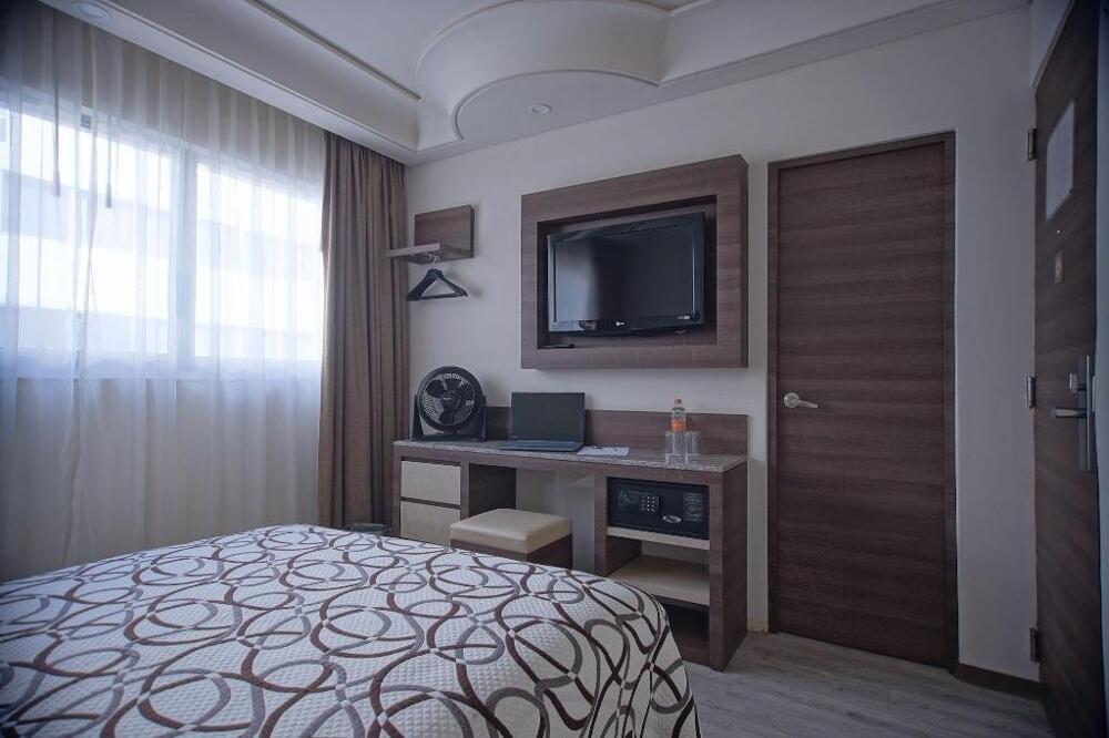 Foto de una habitación de Econo Express Hotel