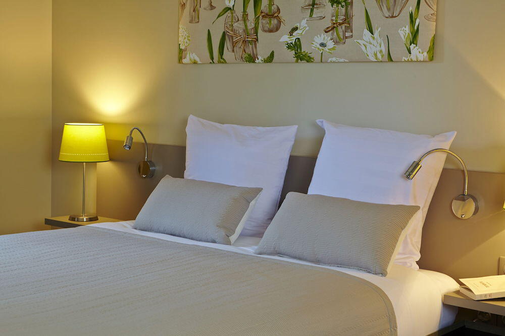 Foto de una habitación de Hotel Les Herbes Folles