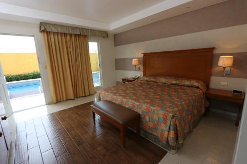 Foto de una habitación de Hotel MESÓN DE LA RIVERA