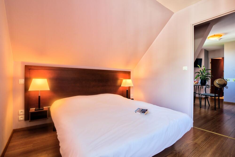 Foto de una habitación de Zenitude Hôtel-Résidences Les Jardins de Lourdes
