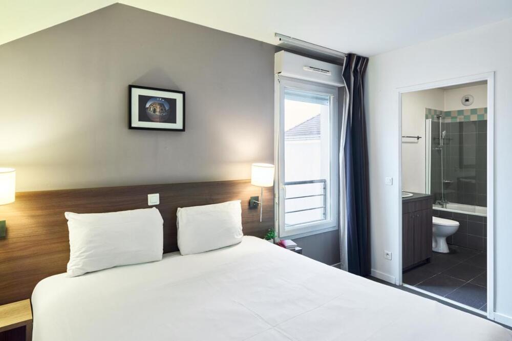 Foto de una habitación de Zenitude Hôtel Résidences Roissy Village