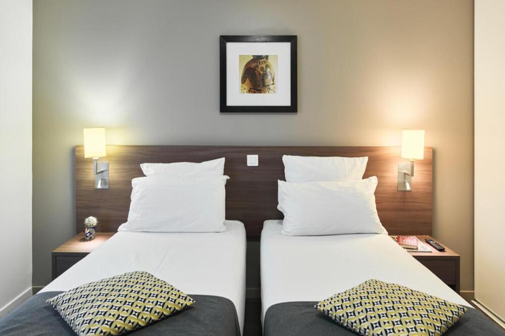 Foto de una habitación de Zenitude Hôtel Résidences Roissy Village