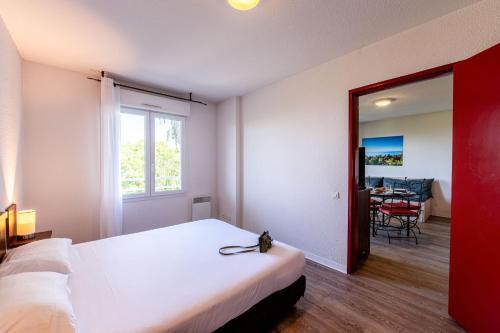 Foto de una habitación de Zenitude Hôtel-Résidences Les Terrasses du Lac
