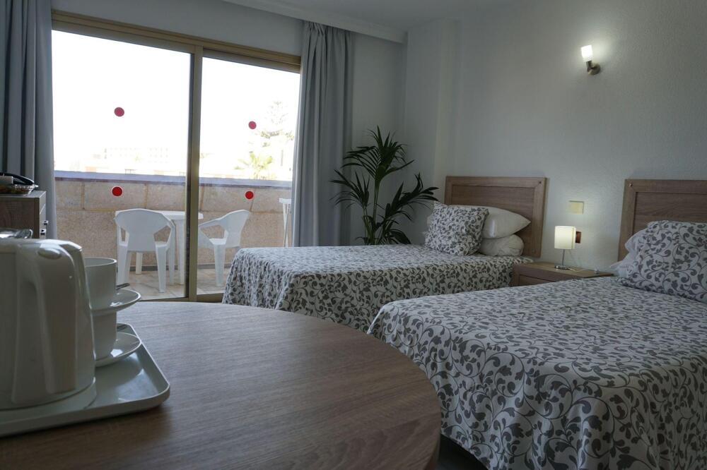 Foto de una habitación de Apartamentos Las Piramides Resort