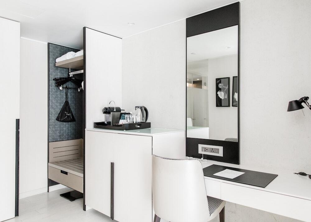 Foto del baño de Naumi Hotel