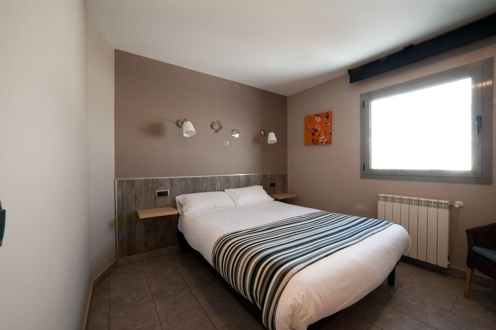 Foto de una habitación de Aparthotel Les Olimpiades