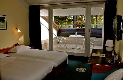 Foto de una habitación de Golf Hotel La Pinetina