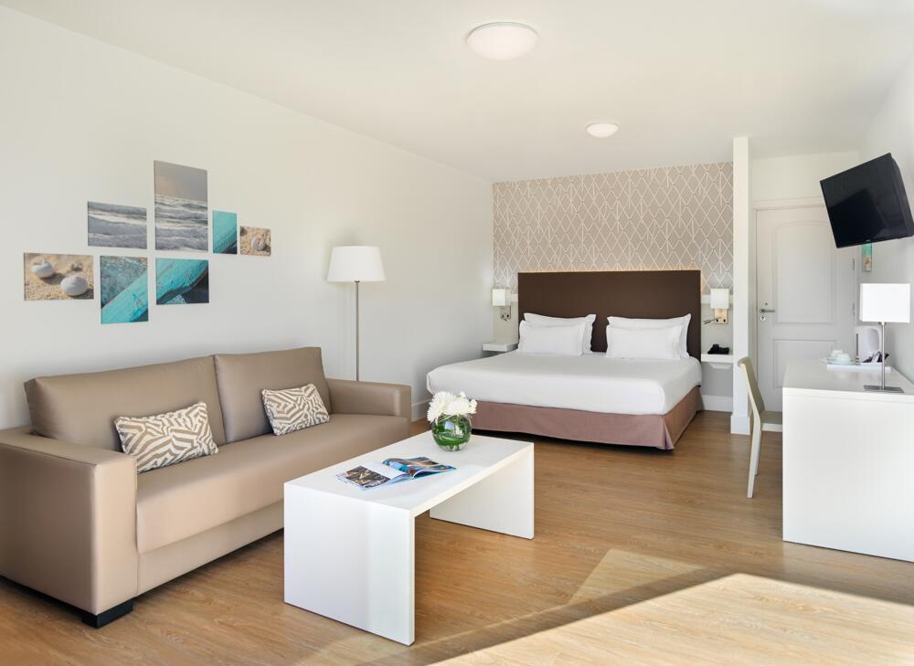 Foto de una habitación de Arena Suite Hotel
