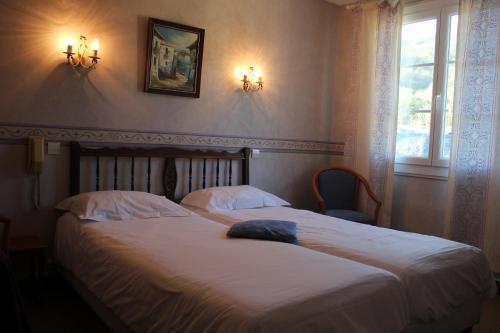 Foto de una habitación de Logis Hôtel Les Cimes