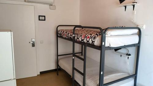 Foto de una habitación de Albergue Arc House Barcelona