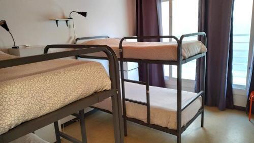 Foto de una habitación de Albergue Arc House Barcelona