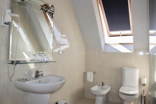 Foto del baño de Hotel As Camelias