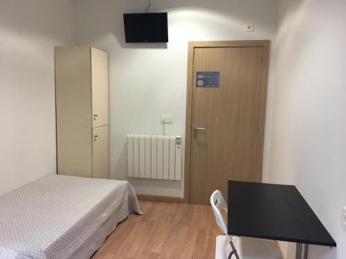 Foto de una habitación de Pensión-Albergue Puente Ribeira
