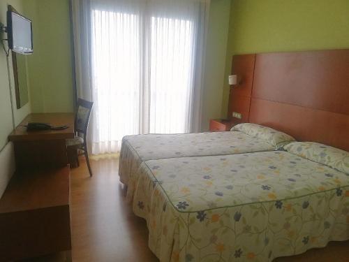 Foto de una habitación de Hotel A Raiña
