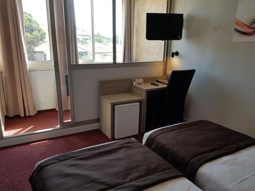 Foto de una habitación de Hôtel Port Beach