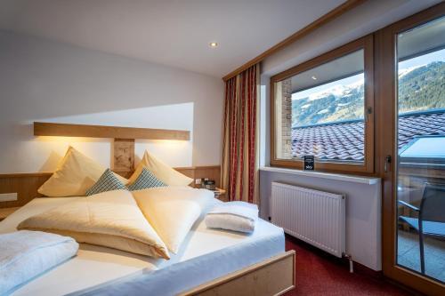 Foto de una habitación de Alpenhof Hotel Garni Suprême