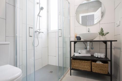 Foto del baño de Apartamentos SingularStays Parque Central