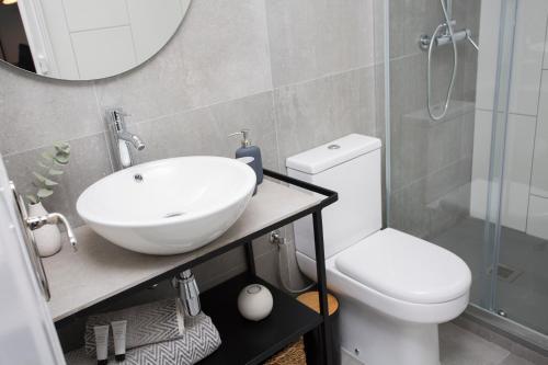 Foto del baño de Apartamentos SingularStays Parque Central