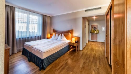 Foto de una habitación de HOTEL POST alpine cityflair