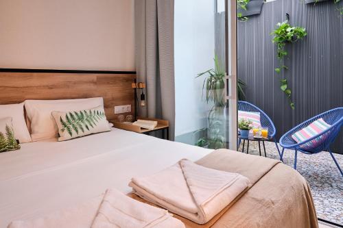 Foto de una habitación de Sweet Sevilla Suites