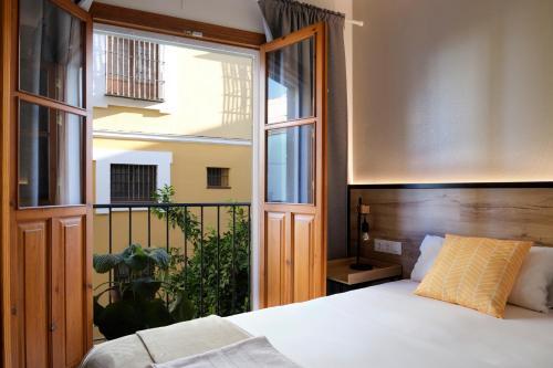 Foto de una habitación de Sweet Sevilla Suites