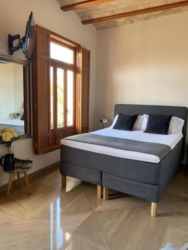 Foto de una habitación de Hotel Reina Rooms