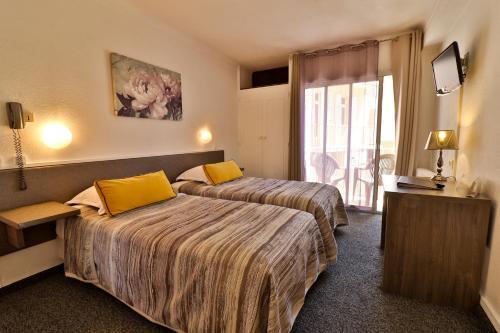 Foto de una habitación de Hôtel le Chardon Bleu
