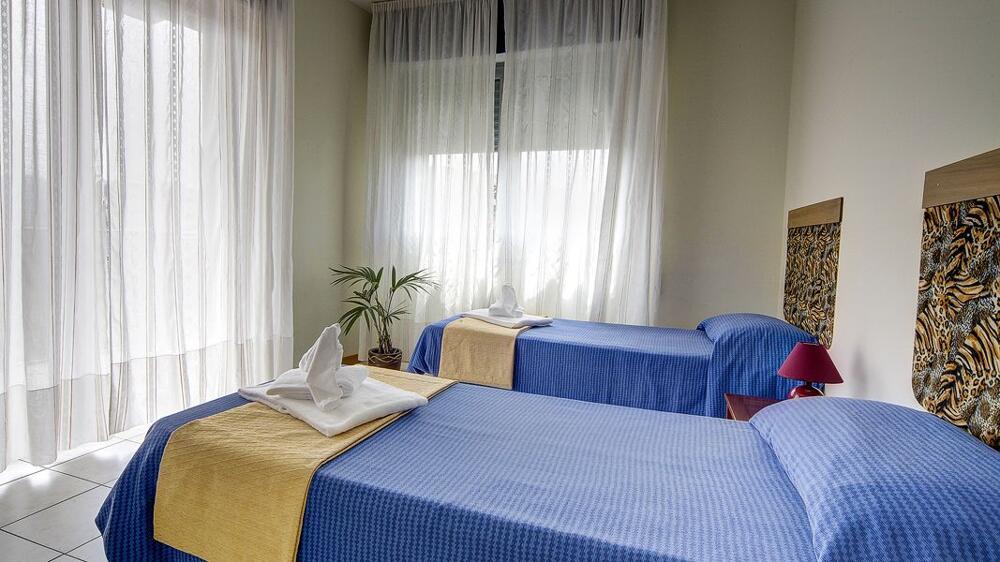 Foto de una habitación de Aparthotel Residence Le Corniole