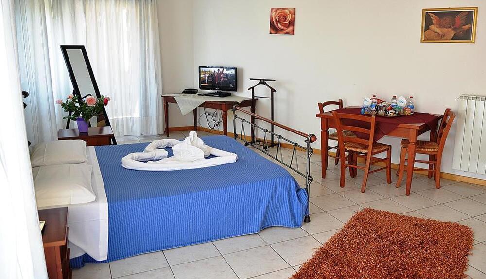 Foto de una habitación de Aparthotel Residence Le Corniole