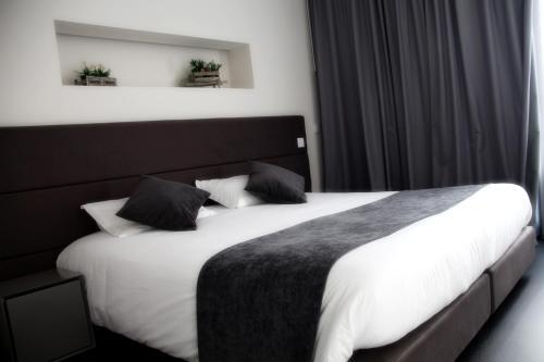 Foto de una habitación de Basto Vila Hotel