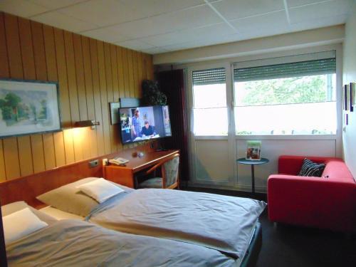 Foto de una habitación de Hotel Schleifmühle