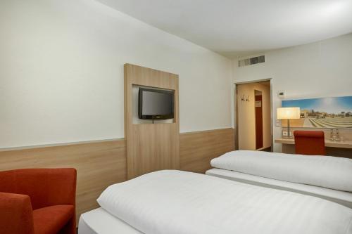 Foto de una habitación de H+ Hotel Darmstadt