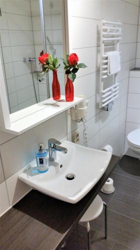 Foto del baño de Hotel-Pension Grüne Linde