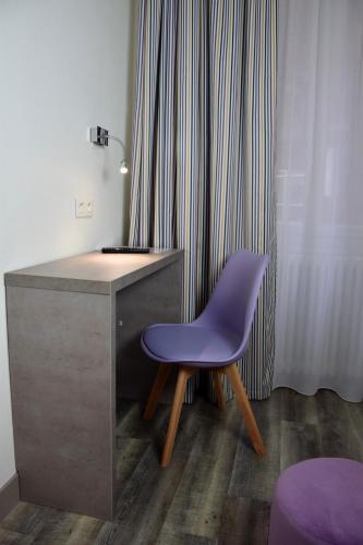 Foto de una habitación de Hotel Citotel L&amp;#039;univers
