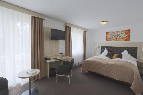 Foto de una habitación de Parkhotel Bilm im Glück am Stadtrand Hannovers