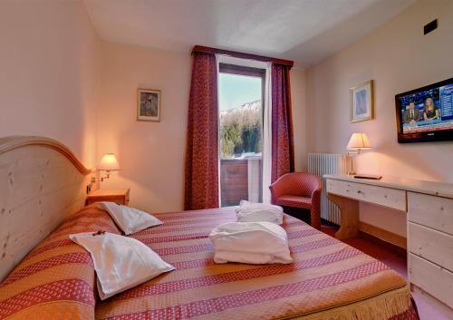 Foto de una habitación de Hotel Caminetto