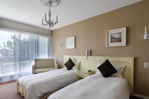 Foto de una habitación de Hotel du Parc