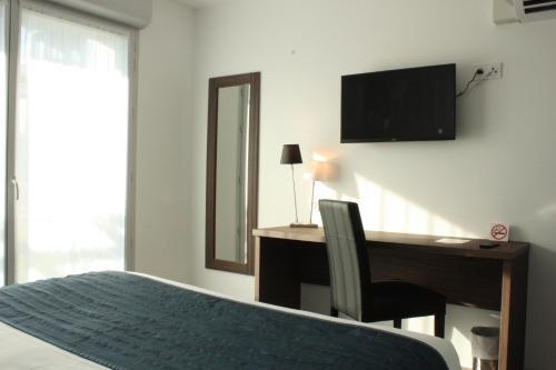 Foto de una habitación de Hotel Libera Caen Colombelles
