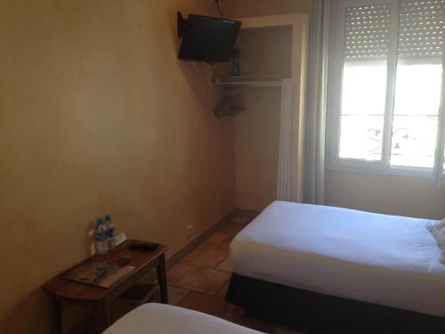 Foto de una habitación de Hotel Le Relais de la Calèche