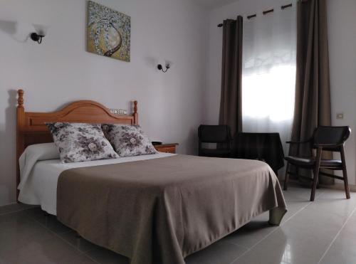 Foto de una habitación de Hostal Los Arcos