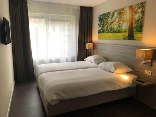 Foto de una habitación de Fletcher Hotel-Restaurant de Witte Brug