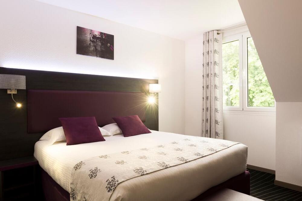 Foto de una habitación de The Originals City Hôtel, Aéroport Beauvais (ex: Inter-Hotel)