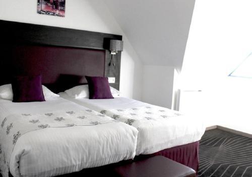 Foto de una habitación de The Originals City Hôtel, Aéroport Beauvais (ex: Inter-Hotel)