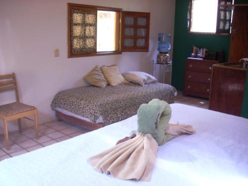 Foto de una habitación de Hotel Macan Ché B&amp;amp;B